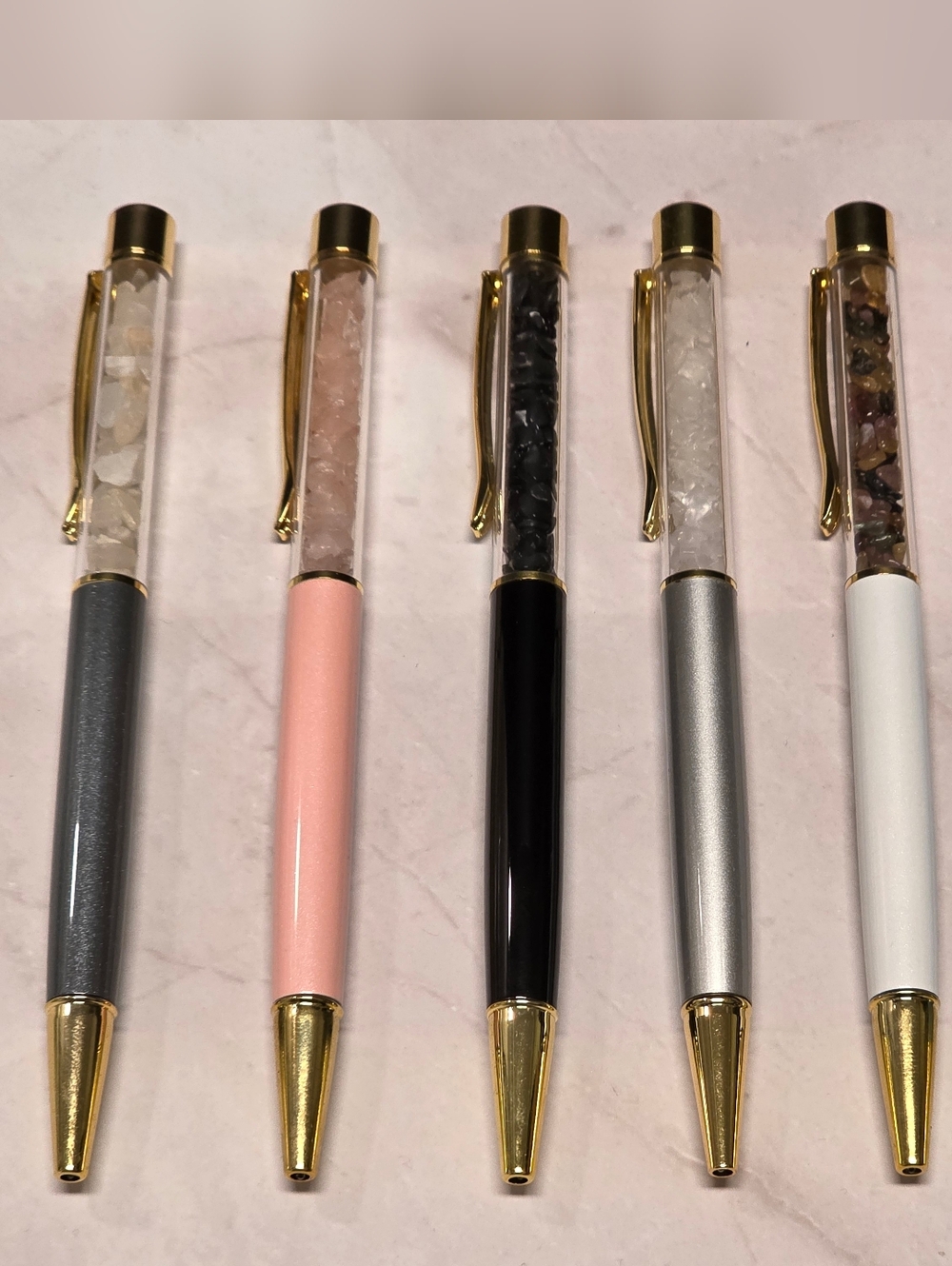 Elegant Crystal Filled Ballpoint Pen with Gold Trim.
